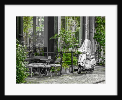 Scooter parked by street cafe by Assaf Frank